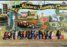 NVE 4th-graders in front of mural